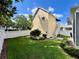 Backyard featuring manicured lawn, privacy fence, and a detached unit with exterior access at 508 Sycamore St, Celebration, FL 34747