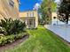 Lush backyard featuring a well-kept lawn and white fence enhancing privacy at 508 Sycamore St, Celebration, FL 34747