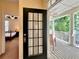 View of a home's door to a front porch featuring columns and a relaxing rocking chair at 508 Sycamore St, Celebration, FL 34747