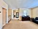 Open hallway with natural light, access to various rooms and a stylish accent table at 508 Sycamore St, Celebration, FL 34747