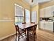 Cozy kitchen nook featuring a wooden table set near window and bright, natural light at 508 Sycamore St, Celebration, FL 34747