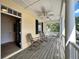 Inviting outdoor porch with rocking chairs, providing a relaxing space with lots of light at 508 Sycamore St, Celebration, FL 34747