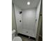 White subway tile shower with a black shower head, hardware, and patterned floor tile at 5216 Davisson Ave, Orlando, FL 32810