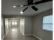 Open living room with wood-look flooring and plenty of natural light offers a comfortable area at 5216 Davisson Ave, Orlando, FL 32810
