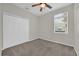 Cozy bedroom featuring a ceiling fan, a window bringing in natural light, and a closet at 530 Hiawatha Palm Pl, Apopka, FL 32712