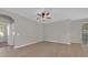 Versatile bonus room with tile flooring and sliding glass door leading to outdoor area at 530 Hiawatha Palm Pl, Apopka, FL 32712