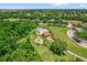 Aerial view of a community pool with lush landscaping and ample seating at 530 Hiawatha Palm Pl, Apopka, FL 32712