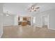 Open kitchen features stainless steel appliances, wood cabinets, and a center island at 530 Hiawatha Palm Pl, Apopka, FL 32712