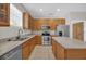 Functional kitchen featuring granite countertops, stainless steel appliances, and ample cabinet space at 530 Hiawatha Palm Pl, Apopka, FL 32712