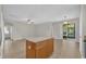 Bright and spacious living room featuring tile flooring and access to the screened lanai at 530 Hiawatha Palm Pl, Apopka, FL 32712