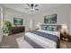 Elegantly staged main bedroom with a plush bed and stylish decor and furnishings at 530 Hiawatha Palm Pl, Apopka, FL 32712