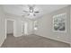 Spacious main bedroom filled with natural light, complemented by neutral walls and carpet at 530 Hiawatha Palm Pl, Apopka, FL 32712