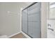 Modern walk-in shower with glass doors, complemented by neutral tiling and fixtures at 530 Hiawatha Palm Pl, Apopka, FL 32712
