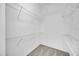 Walk-in closet with ample storage space and shelving for optimal organization at 530 Hiawatha Palm Pl, Apopka, FL 32712