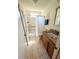 Well-lit bathroom with granite counters, tiled floors, and a shower with tub at 600 Lake St, Fruitland Park, FL 34731
