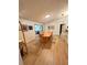 Bright dining room with wood floors, a large table with seating, and modern decor at 600 Lake St, Fruitland Park, FL 34731
