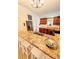 Updated kitchen featuring a breakfast bar, granite counters, and stainless appliances at 600 Lake St, Fruitland Park, FL 34731