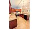 A kitchen with stainless steel appliances, granite counters, and tile floors at 600 Lake St, Fruitland Park, FL 34731