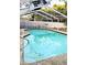 Sparkling pool in screened enclosure, accented by lush landscaping and a secure privacy fence at 600 Lake St, Fruitland Park, FL 34731