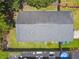 Birds-eye view of home featuring a gray roof, fenced yard, and well-maintained landscaping at 6148 Landrace Ln, Orlando, FL 32807