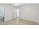 Spacious bedroom featuring tile floors, a ceiling fan, and ample natural light at 6148 Landrace Ln, Orlando, FL 32807