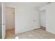 Bedroom with tile flooring featuring an open closet space and access to other rooms at 6148 Landrace Ln, Orlando, FL 32807