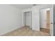 Bedroom featuring tile floors, a closet, and access to another room at 6148 Landrace Ln, Orlando, FL 32807