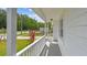Inviting front porch view with decorative plants at 6148 Landrace Ln, Orlando, FL 32807