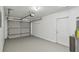 A clean garage features an automatic door and plenty of storage space at 6148 Landrace Ln, Orlando, FL 32807
