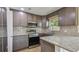 Modern kitchen with stainless steel appliances and granite countertops at 6148 Landrace Ln, Orlando, FL 32807