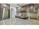 Updated kitchen with stainless steel appliances and granite countertops at 6148 Landrace Ln, Orlando, FL 32807