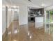 Open-concept living room featuring neutral paint, tile floors and sliding glass doors at 6148 Landrace Ln, Orlando, FL 32807