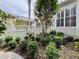 Cozy backyard garden featuring lush greenery, bird bath, and privacy fence at 616 Nadina Pl, Celebration, FL 34747