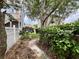 Backyard featuring a stone pathway, well-maintained lawn, and privacy fence at 616 Nadina Pl, Celebration, FL 34747
