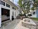 Outdoor patio with stone floors, string lights, and wicker furniture at 616 Nadina Pl, Celebration, FL 34747