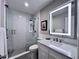 Stylish bathroom featuring updated fixtures, glass shower, and marble countertop at 616 Nadina Pl, Celebration, FL 34747