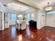 Formal dining room with tray ceiling, elegant lighting, and ample space for entertaining guests at 616 Nadina Pl, Celebration, FL 34747