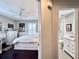 Hallway with views of a bedroom with dark wood floors and an updated bathroom with a stand-alone shower at 616 Nadina Pl, Celebration, FL 34747
