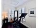 Bright home gym with exercise bike, natural light, and sleek hardwood floors at 616 Nadina Pl, Celebration, FL 34747