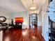 Bright living room with hardwood floors, stylish decor, and an open floor plan into the dining area at 616 Nadina Pl, Celebration, FL 34747