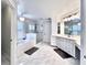 Luxurious primary bathroom featuring double vanity, soaking tub, and glass-enclosed shower at 616 Nadina Pl, Celebration, FL 34747