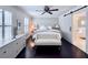 Serene primary bedroom featuring a plush bed, natural light, and private bath at 616 Nadina Pl, Celebration, FL 34747