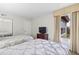 Bedroom with two twin beds, natural light from window, and a dark wood dresser at 6402 Parc Corniche Dr # 5304, Orlando, FL 32821