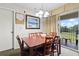 Cozy dining area with seating for six next to sliding glass doors to the exterior at 6402 Parc Corniche Dr # 5304, Orlando, FL 32821