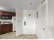 Efficient kitchenette with a microwave, granite countertops, cabinets, and tile floors at 6402 Parc Corniche Dr # 5304, Orlando, FL 32821