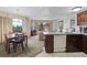 Inviting living space featuring a dining area, a kitchenette, and comfortable seating by the window at 6402 Parc Corniche Dr # 5304, Orlando, FL 32821