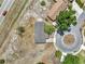 Bird's eye view of a home with a gray roof and nearby cul-de-sac and surrounding foliage at 7 Garvey Ln, Frostproof, FL 33843