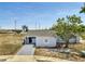 Charming single-story home with a well-maintained yard and private driveway, offering a cozy curb appeal at 7 Garvey Ln, Frostproof, FL 33843