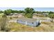 Aerial view of a single-story home with simple landscaping and exterior porch at 7 Garvey Ln, Frostproof, FL 33843