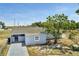 Charming single-story home with a well-maintained yard and private driveway, ideal for comfortable living at 7 Garvey Ln, Frostproof, FL 33843